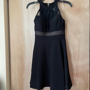 Little black dress with see thru detail in the front.